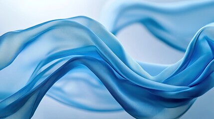 Soft, flowing blue fabric suspended in air, creating gentle waves and curves against a light backdrop