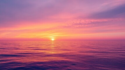 Fototapeta premium Stunning sunset painting the sky with hues of orange, pink, and purple over a calm horizon