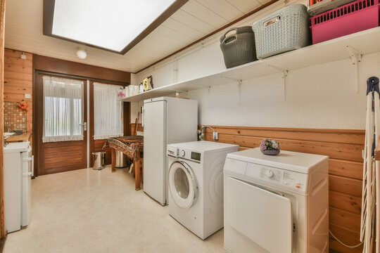 Cozy laundry room with appliances and storage