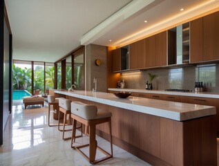 Modern Kitchen with Island, Bar Stools, and Pool View