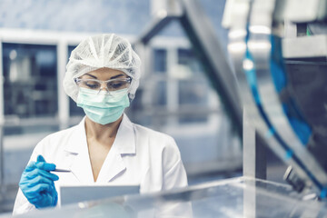 Hygiene women worker work in science laboratory. people in pharmaceutical medicine production...