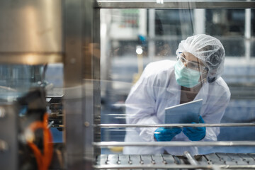 Hygiene women worker work in science laboratory. people in pharmaceutical medicine production...