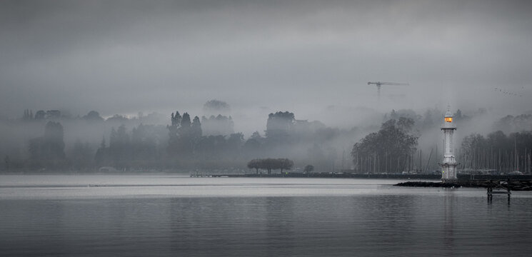 Foggy morning at Bains des Paquis, Geneva, overlooking Lake Leman