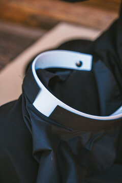 Close-up view of a Catholic priest's collar in Altea, Spain