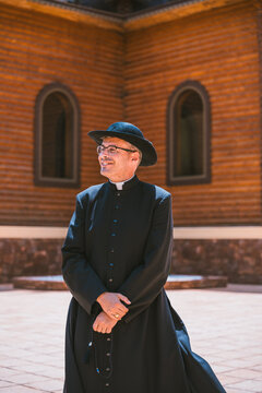Catholic priest outside an Orthodox church in Altea, Spain