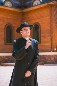 Catholic priest outside an Orthodox church in Altea, Spain