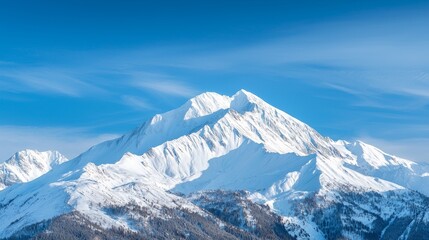 Snow-capped mountains under a clear blue sky, winter weather, cold and majestic