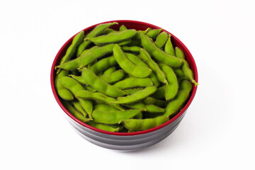 Black Bowl Filled with Vibrant Green Edamame Beans Isolated on White Background