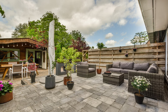 Inviting backyard patio with dining and lounge areas