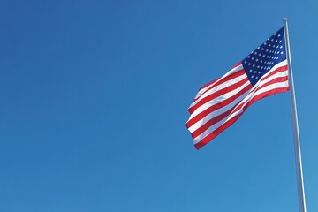 Obraz premium American flag waving against clear blue sky