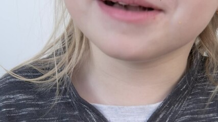 small child, blonde girl 4 years old eating croissant, chewing sweets, kid has good appetite, happy childhood, balanced diet, sweet life, unhealthy food