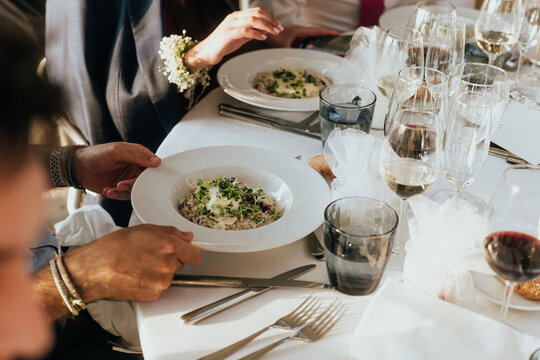 Elegant wedding table setting with gourmet dishes and fine wine