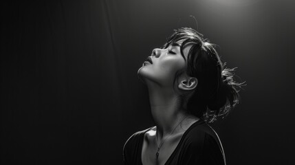 Black and white illustration of a woman looking up and praying to the sky.