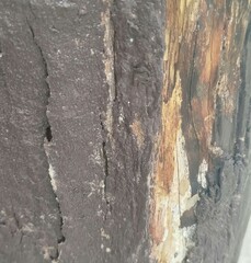 Surface of old brown chipped and deteriorated wood texture