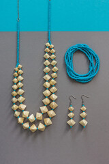 Straw and bead necklace, straw and bead earrings and blue beaded bracelet. Blue beaded. Gray...