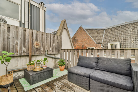 Cozy rooftop terrace with comfortable seating and plants
