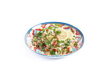 Tabbouleh salad with couscous and vegetables isolated on white background