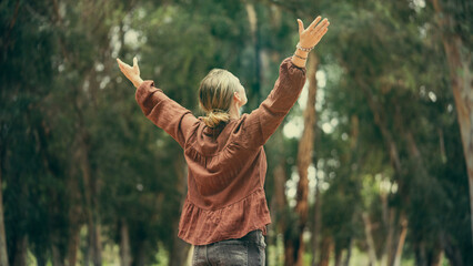 Woman breathing fresh air outdoors	