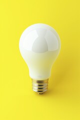 White light bulb isolated on yellow background