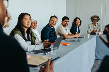 Diverse group of employees in business discussion during a strategy meeting