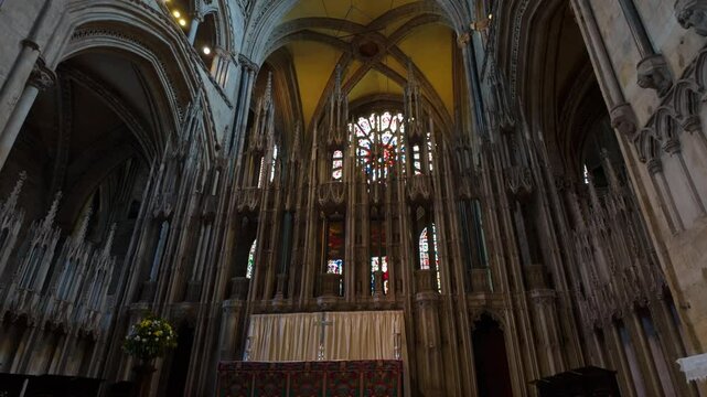 Camera rises to reveal nave and main window of Durham Cathedral, Durham, England 