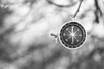 Classic navigation compass on natural background