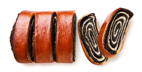 Poppy seed roll cut into pieces close-up on a white. Top view