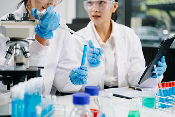 Modern medical research laboratory. female scientist hands working with micro pipettes analyzing...