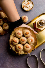 Panjiri Ladoo Indian Sweets on a indian female hands celebrating  indian festivals 