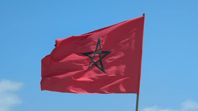 view of a Moroccan Flag waiving against blue sky