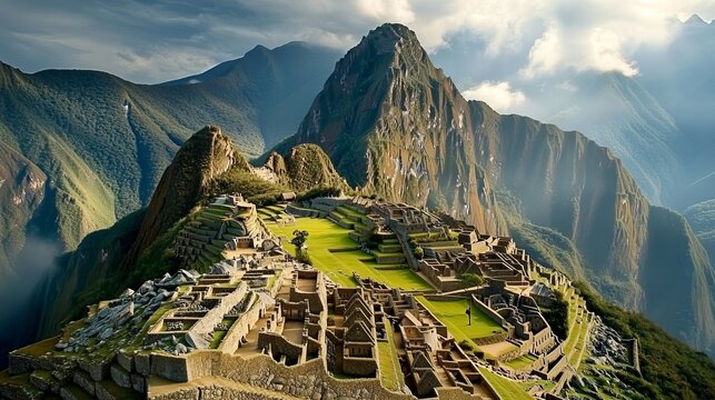A view of the Machu Picchu citadel in Peru, showcasing its ancient stone structures and dramatic mountain backdrop amidst the misty highland landscape. - Powered by Adobe