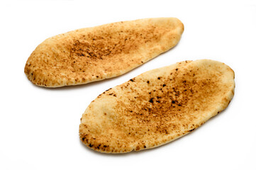 whole greek pita bread isolated on white background