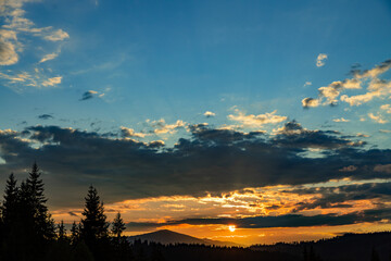 Beautiful landscape with clouds in the mountains at sunrise.