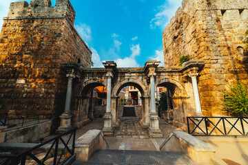 Hadrian's Gate. The three gates that are the symbol of Antalya. Photo taken from a low angle on a cloudy day. Turkey.