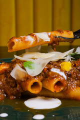 Ziti napoletani con genovese di polpo e guarniti con scaglie di provolone del monaco e panna acida...
