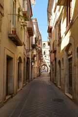 A street between old houses of Isernia, a city in Molise,  Italy.