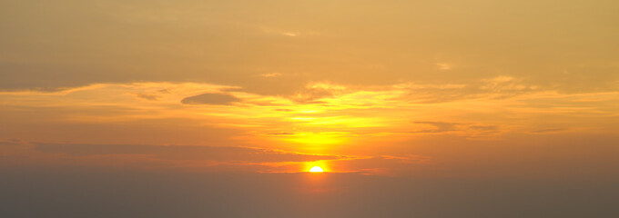The morning sky looked like a bright sky. Wide photo. The sunrise is decorated with clouds in various shapes.