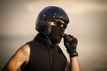Biker in Full Gear with Helmet and Goggles..