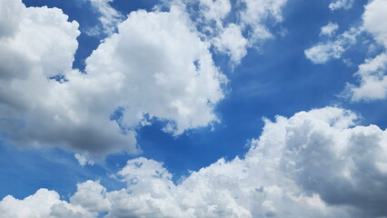 Clear Sky. Elegant empty sky background. Horizon Spring, Blue sky background with soft white clouds. Cumulus clouds,  blue sky in summer with tiny clouds.
