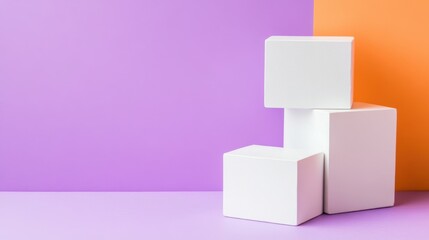 Stacked white cubes arranged against a vibrant two-tone background in purple and orange, creating a minimalist geometric composition.