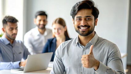 Indian Man with Thumbs Up at Team Meeting
