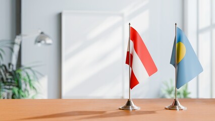 FLAGS OF AUSTRIA AND PALAU ON TABLE