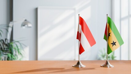 FLAGS OF AUSTRIA AND SAO TOME ON TABLE