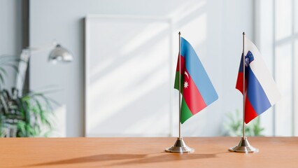 FLAGS OF AZERBAIJAN AND SLOVENIA ON TABLE