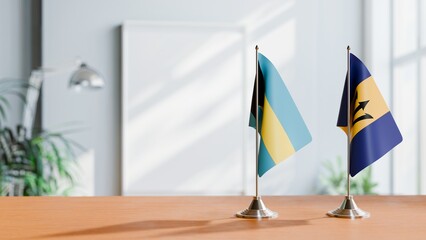 FLAGS OF BAHAMAS AND BARBADOS ON TABLE