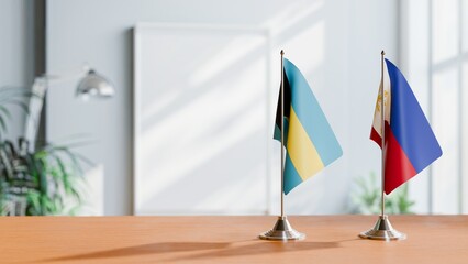 FLAGS OF BAHAMAS AND PHILIPPINES ON TABLE