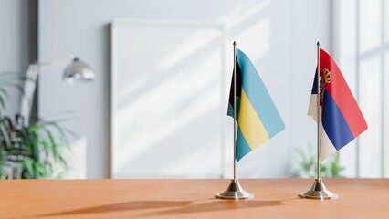 FLAGS OF BAHAMAS AND SERBIA ON TABLE