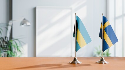 FLAGS OF BAHAMAS AND SWEDEN ON TABLE