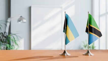 FLAGS OF BAHAMAS AND TANZANIA ON TABLE