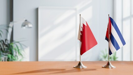 FLAGS OF BAHRAIN AND CUBA ON TABLE